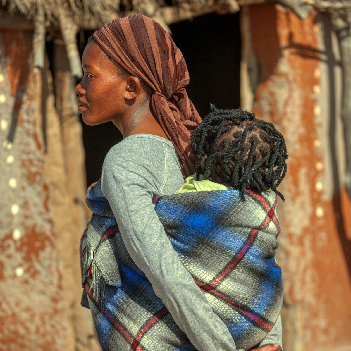 a woman carrying a child